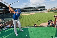 BMW Championship defending championDustin Johnson tees off from a speciallyconstructed platform in the stands atWrigley Field to mark the start of the 2011BMW Championship.