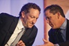 Larry Baer (left) of the San Francisco Giants and Jamey Rootes of the Houston Texans confer during a panel featuring team officials.