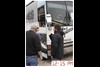 Hines talks with the driver of the Gibson Guitar bus, which will serve as the green room for the night’s headline performer, Robin Thicke.