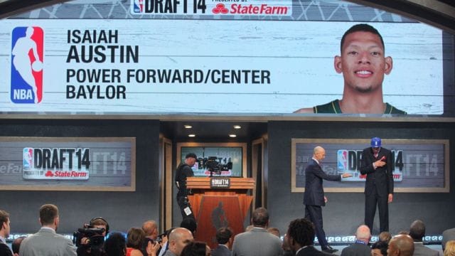Jun 26, 2014; Brooklyn, NY, USA; Isaiah Austin (Baylor) reacts while on stage with NBA commissioner Adam Silver after being selected as an honorary draft pick by the NBA during the 2014 NBA Draft at the Barclays Center. Austin was diagnosed with Marfan Syndrome ending his career. Mandatory Credit: Brad Penner-USA TODAY Sports