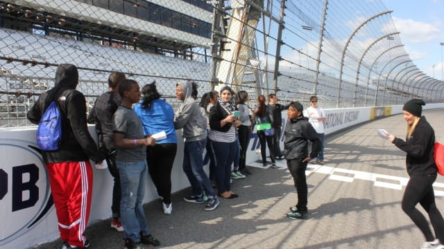 Students get time on the track to learn how the timing system works and how race officials keep track of each race car.