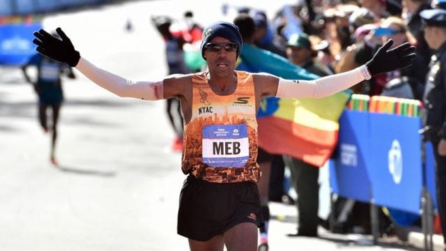 Nov 2, 2014; New York, NY, USA; Meb Keflezighi (5) reacts as he crosses the finish line of the 2014 TCS New York City Marathon. Mandatory Credit: Derik Hamilton-USA TODAY Sports